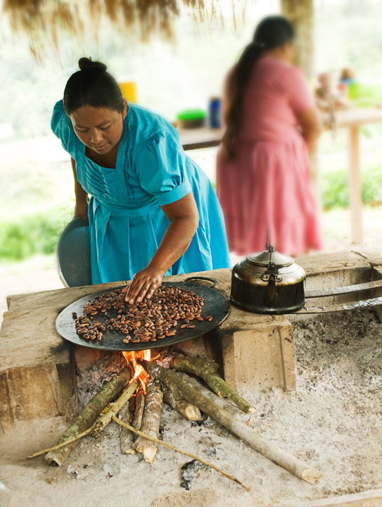 RoastingCacao_2392.jpg - One of Eladio's daughters is seen here roasting Cacao beans which she then cracked and processed to make us a hot cocoa drink.