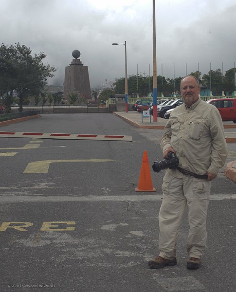 Equator-2231.jpg - The Quito Equatorail Monument in the background. The stone monument sits astride the equator. We shot from a distance as there was a fee to proceed beyond this point.