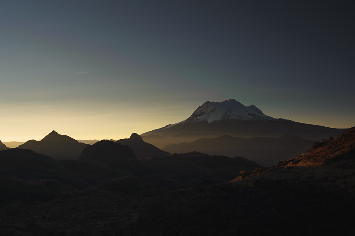 Papallacta_2749.jpg - The volcano, Antisana, as seen from the Papallacta Pass. The pass crosses the Andes at about 13,000+ feet and is marked with a large sign reading, "Curva de la Muerte."  Even I could translate that one.